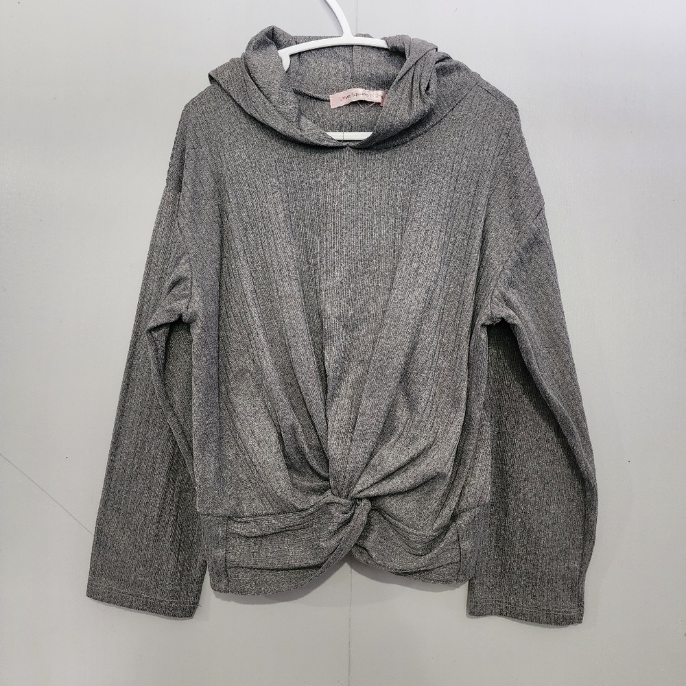 Girl long sleeve grey top with decorative front bottom twist design. Size med